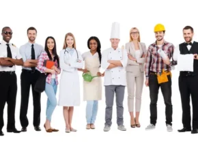 A diverse group of ten professionals in various uniforms including a pilot, doctor, chef, and construction worker, standing together.