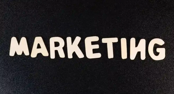 The word "MARKETING" displayed in playful, white letters on a black background.